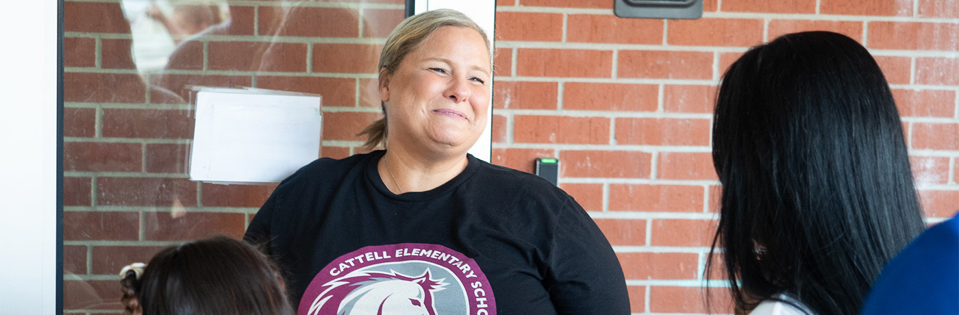 Teacher smiling at students